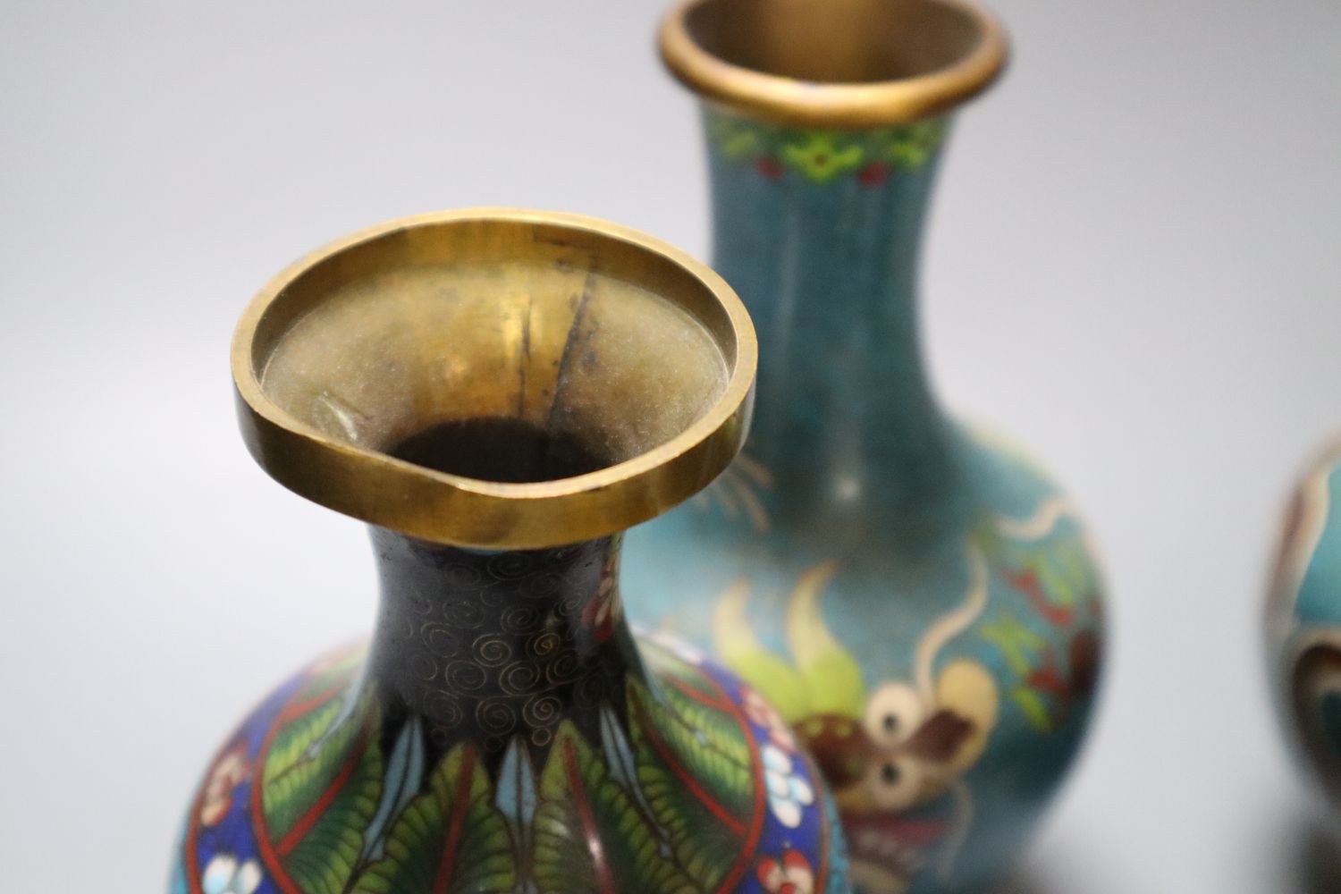 A pair of Chinese cloisonne enamel vases, 17cm and three other cloisonne vessels